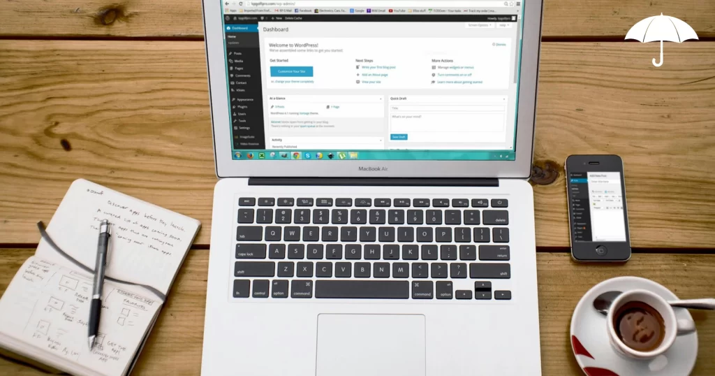 a laptop computer sitting on a desk along with a notepad, phone and cup of coffee. The computer screen shows the ClickUp website