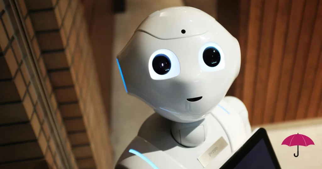 A smiling friendly robot holding an ipad