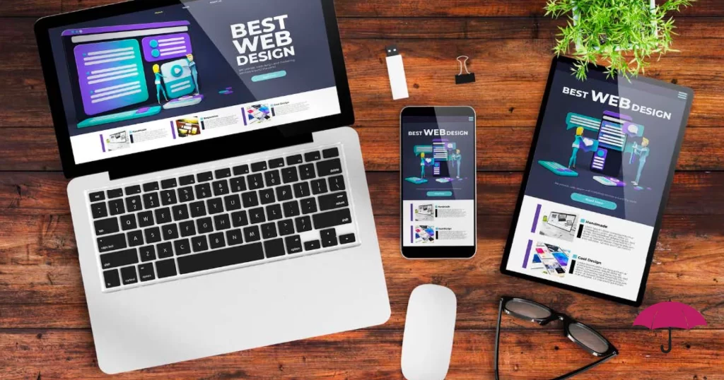 multiple devices like a laptop, phone and tablet, on a wooden table, focused on web design