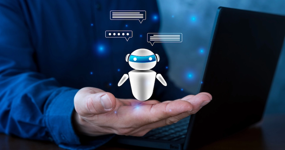 Person holding small white AI robot in hand with caption bubbles
